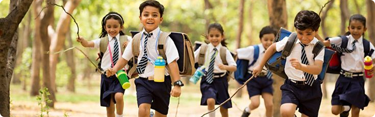 Students running outdoors with backpacks